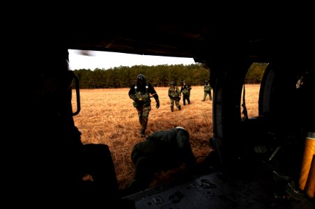 US Navy 070208-N-7918H-151 Sailors assigned to Explosive Ordnance Disposal Unit Two (EODMU-2) board an MH-60S Seahawk assigned to the Chargers of Helicopter Combat Support Squadron Two Six (HSC-26) to conduct static-line jump o
