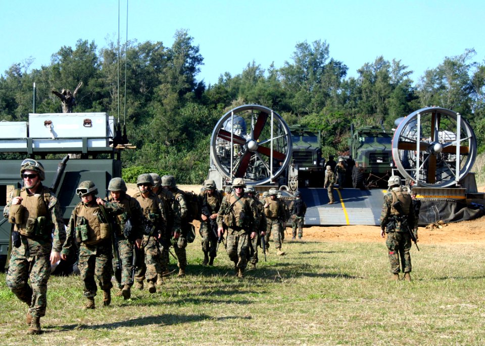 US Navy 070206-N-6710M-002 Marines assigned to the 31st Marine Expeditionary Unit exit a Landing Craft Air Cushion (LCAC) onto the shores of Okinawa, Japan, for training