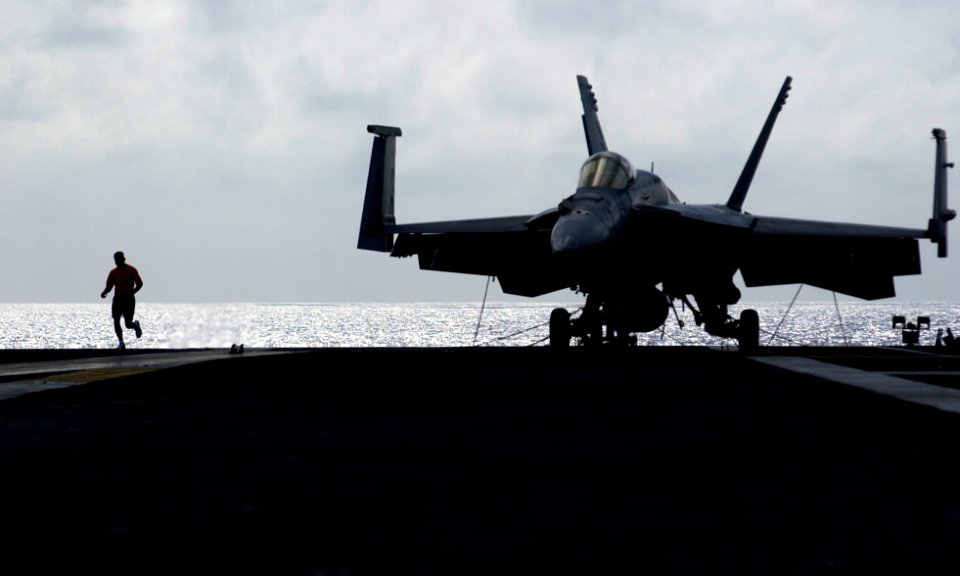 US Navy 070201-N-7130B-072 During a no-fly day, a Sailor takes advantage of the opportunity to run on the flight deck of USS Ronald Reagan (CVN 76)