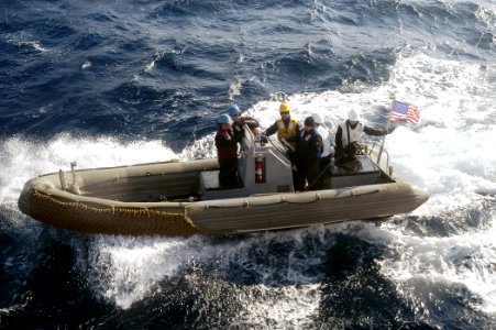 US Navy 070203-N-4649C-069 Sailors assigned to Arleigh Burke-class guided missile destroyer USS Stethem (DDG 63) receive training on board a rigid hull inflatable boat (RHIB) photo