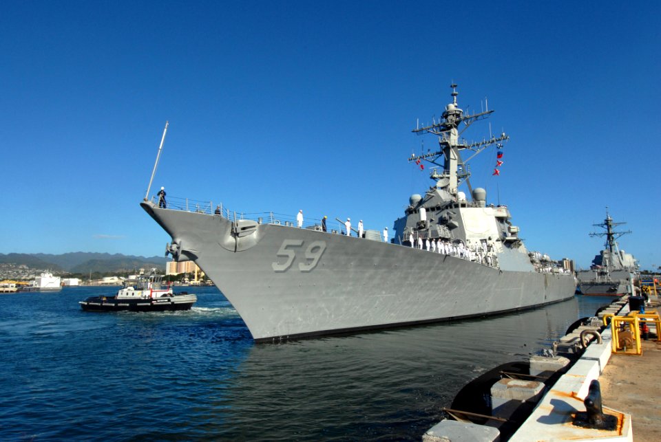 US Navy 070203-N-4965F-018 Sailors aboard guided missile destroyer USS Russell (DDG 59) man the rails as the ship gets underway from Naval Station Pearl Harbor
