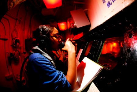 US Navy 070209-N-3729H-029 Aviation Boatswain's Mate Tameca Howard stands fire watch in the hangar bay conflagaration station during a General Quarters drill aboard the Nimitz-class aircraft carrier USS John C. Stennis (C photo