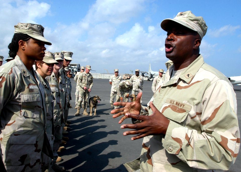 US Navy 070207-N-1328C-110 Combined Joint Task Force-Horn of Africa Chaplain (Capt.) Ronnie King speaks of a relationship between a military working dog and his or her handler, during a memorial service for Curly, a military wo