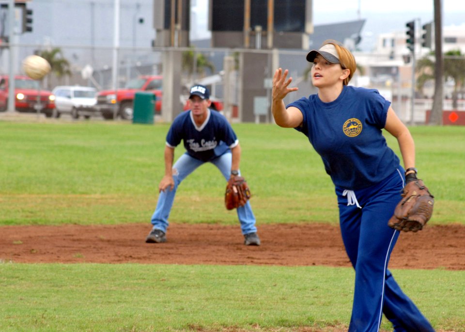 US Navy 070209-N-4965F-026 Master-at-Arms 1st Class Jinine Green, assigned to Naval Station Pearl Harbor Security, pitches a softball during a Chief Petty Officer's Association versus 1st Class Petty Officer's Assoc