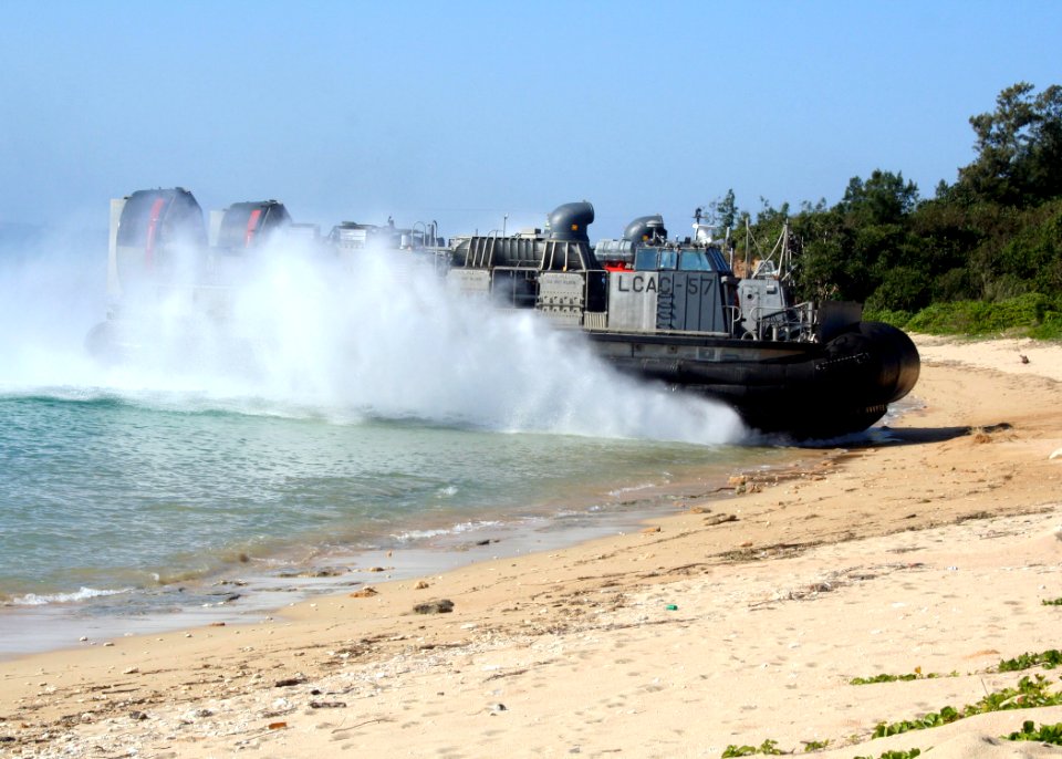 US Navy 070206-N-6710M-008 A Landing Craft Air Cushion (LCAC) carrying Marines and equipment prepares to make a beach landing on the coast of Okinawa, Japan