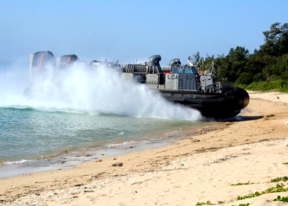 US Navy 070206-N-6710M-008 A Landing Craft Air Cushion (LCAC) carrying Marines and equipment prepares to make a beach landing on the coast of Okinawa, Japan