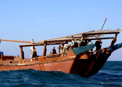US Navy 070209-N-8623S-002 Sailors stationed aboard guided missile destroyer USS Ramage (DDG 61) conduct a visit, board, search and seizure (VBSS) aboard a fishing dhow
