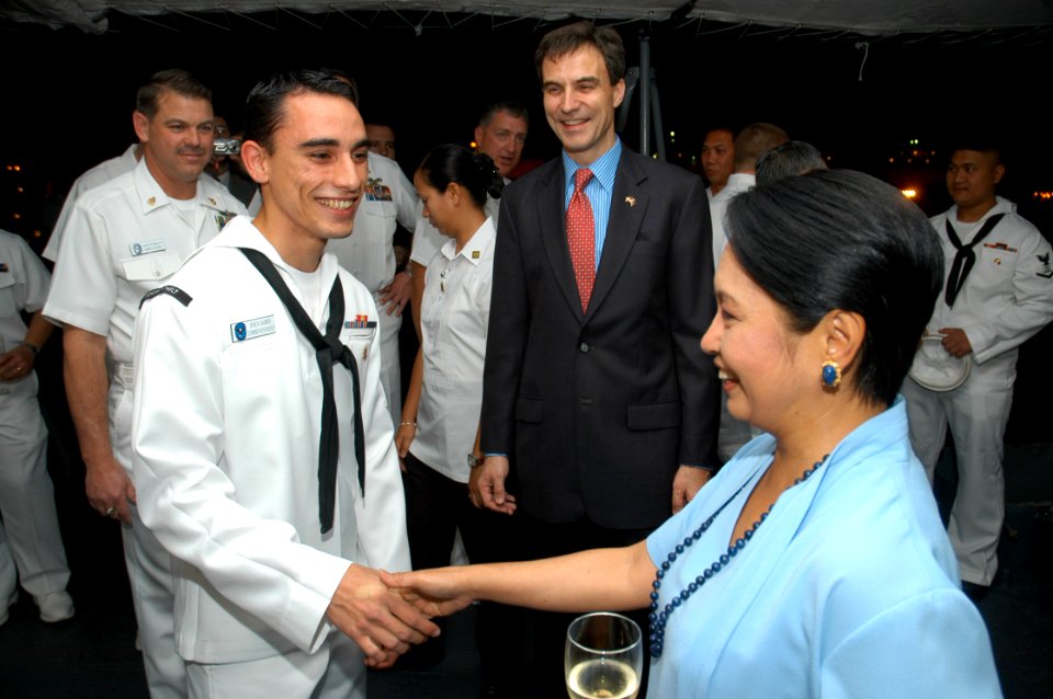 US Navy 070208-N-2468S-004 Seaman Apprentice Jesus Jaimes greets President of the Philippines, Gloria Macapagal Arroyo, during a reception held aboard command-and-control flagship, USS Blue Ridge (LCC 19)
