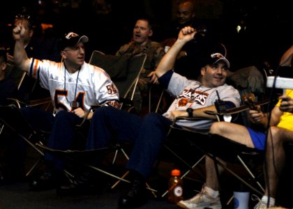 US Navy 070205-N-5330L-002 A few Chicago Bears fans aboard Nimitz-class aircraft carrier USS Dwight D. Eisenhower (CVN 69) celebrate together in the ship's hangar bay after watching Devin Hester return the opening kickoff