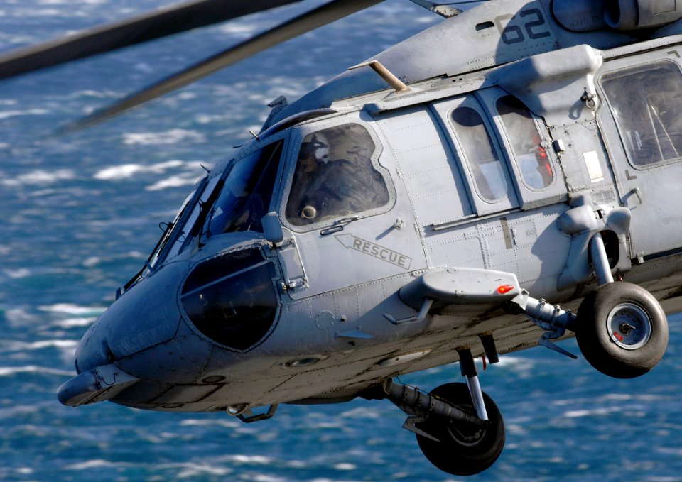 US Navy 070208-N-5345W-064 An MH-60S Seahawk assigned to Helicopter Combat Support Squadron Two Six (HSC-26) banks away from the fantail of Nimitz-class aircraft carrier USS Harry S. Truman (CVN 75)