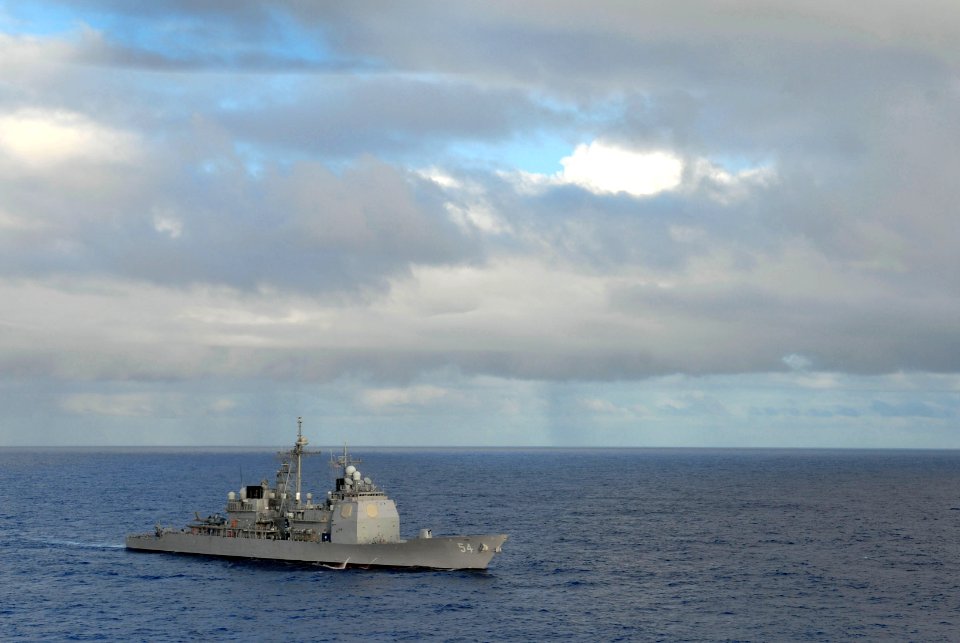 US Navy 070206-N-0684R-035 Guided missile cruiser USS Antietam (CG 54) begins her travel into formation during a photo exercise showcasing the entire John C. Stennis Carrier Strike Group (JCSSG) off the coast of Guam