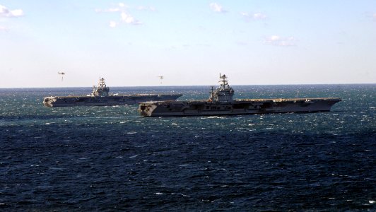 US Navy 070208-N-0535P-109 Nimitz-class aircraft carrier USS Harry S. Truman (CVN 75) conducts an ammunition cross-deck with USS Theodore Roosevelt (CVN 71)
