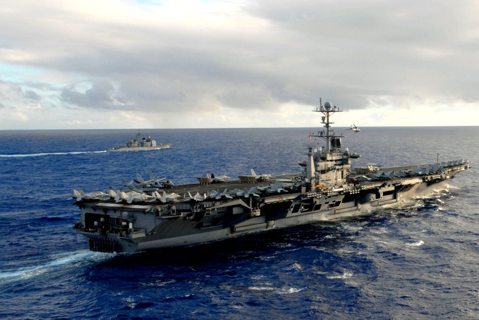 US Navy 070206-N-0684R-390 USS John C. Stennis (CVN 74) and USS Antietam (CG 54) move into formation in preparation for a photo exercise along with USS Preble (DDG 88), USS O'kane (DDG 77) and USNS Bridge (T-AOE-10), off the co