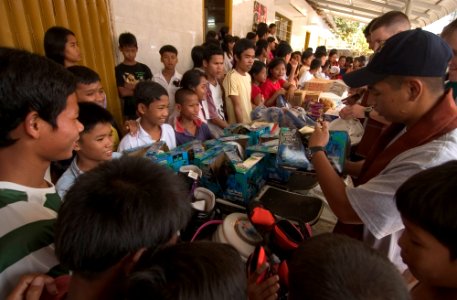 US Navy 070211-N-8534H-012 Guided missile frigate USS Gary (FFG 51) Sailors hand out donated items from Project Handclasp to the 150 children at the Village D'enfants De Sihanoukville Orphanage