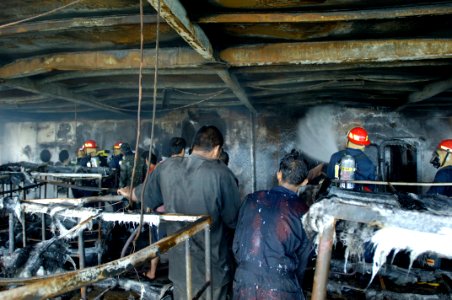 US Navy 070212-N-4790M-237 Members of the rescue and assistance team aboard amphibious command ship USS Blue Ridge (LCC 19) respond to a shipboard fire on board the passenger ferry Manila Bay I