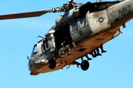 US Navy 070208-N-7918H-764 An MH-60S Seahawk, assigned to the Chargers of Helicopter Combat Support Squadron Two Six (HSC-26), takes off with Sailors assigned to Explosive Ordnance Disposal Unit Two (EODMU-2)