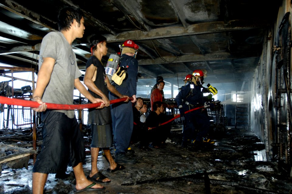 US Navy 070212-N-4790M-258 Members of the rescue and assistance team aboard amphibious command ship USS Blue Ridge (LCC 19) respond to a shipboard fire on board the passenger ferry Manila Bay I