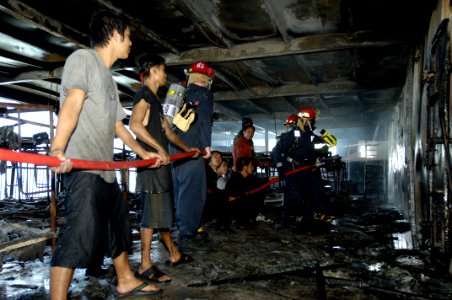 US Navy 070212-N-4790M-258 Members of the rescue and assistance team aboard amphibious command ship USS Blue Ridge (LCC 19) respond to a shipboard fire on board the passenger ferry Manila Bay I