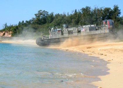 US Navy 070206-N-6710M-020 A Landing Craft Air Cushion (LCAC) prepares to transit Marines and equipment off the coast of Okinawa, Japan, back to dock landing ship USS Tortuga (LSD 46)