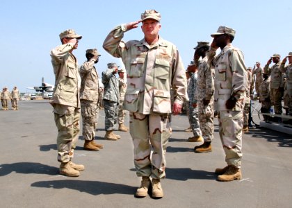 US Navy 070214-N-1328C-043 Incoming Commander, Combined Joint Task Force-Horn of Africa (CJTF-HOA), U.S. Navy Rear Adm. James Hart, passes through side boys during CJTF-HOA change of command ceremony photo