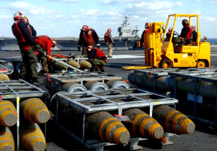 US Navy 070208-N-5345W-044 Weapons department Sailors organize pallets of ordnance aboard USS Harry S. Truman (CVN 75)