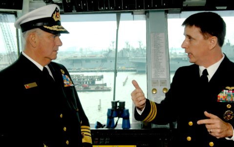 US Navy 070214-N-8923M-003 Air Boss, Cmdr. Ken McKown, talks with the Commander-in-Chief of the Chilean Navy, Adm. Rodolfo Codina Diaz, aboard the Nimitz-class aircraft carrier USS Harry S. Truman (CVN 75)