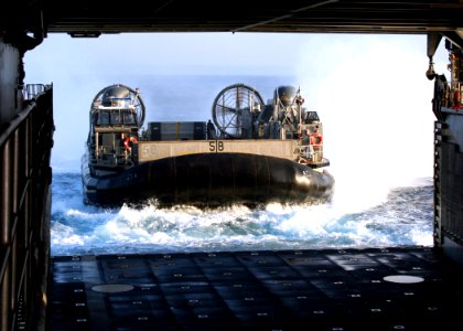 US Navy 070209-N-6710M-001 A Landing Craft Air Cushion (LCAC) prepares to enter the well deck of dock landing ship USS Tortuga (LSD 46) after an offload of Marine equipment in the vicinity of Okinawa, Japan photo