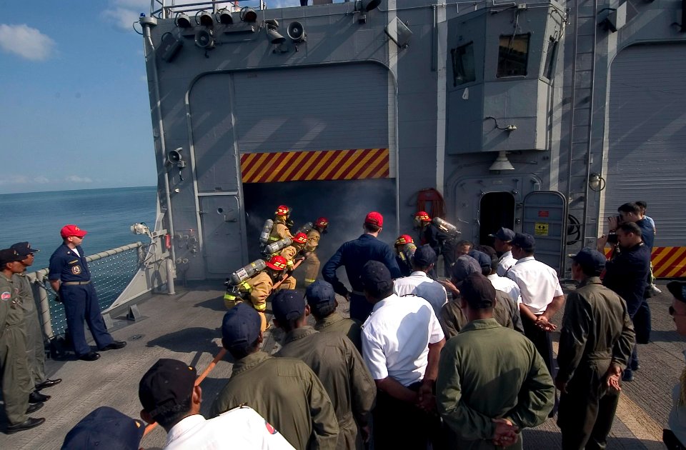US Navy 070211-N-8534H-002 Sailors stationed aboard the guided-missile frigate USS Gary (FFG 51) demonstrate damage control procedures to Royal Cambodian Navy Sailors on the flight deck of Gary
