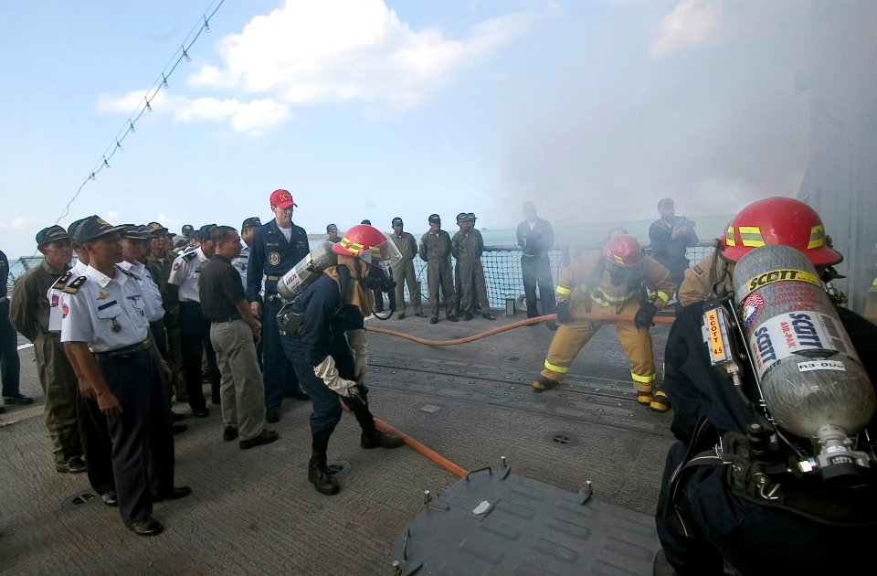 US Navy 070211-N-8534H-003 Sailors stationed aboard the guided-missile frigate USS Gary (FFG 51) demonstrate damage control procedures to Royal Cambodian Navy Sailors on the flight deck of Gary during the ship's 3rd day i