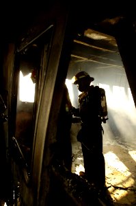 US Navy 070212-N-4790M-014 Members of the rescue and assistance team aboard amphibious command ship USS Blue Ridge (LCC 19) respond to a shipboard fire on board the passenger ferry Manila Bay I