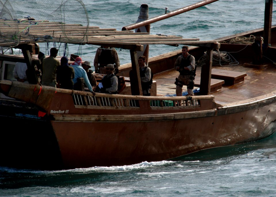 US Navy 070209-N-8623S-013 Sailors stationed aboard guided missile destroyer USS Ramage (DDG 61) conduct a visit, board, search and seizure (VBSS) aboard a fishing dhow
