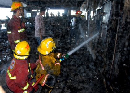 US Navy 070212-N-9860Y-751 Members of the rescue and assistance team aboard amphibious command ship USS Blue Ridge (LCC 19) work with Cebu's Filipino-Chinese Volunteer Fire Brigade in an attempt to help the passenger ferr