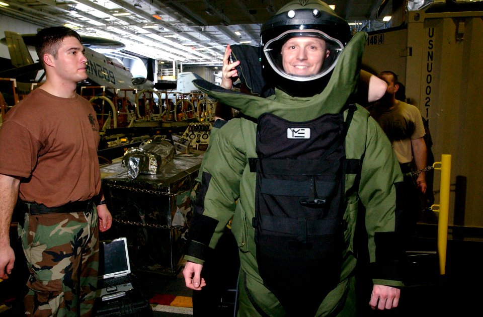 US Navy 070209-N-4009P-160 Explosive Ordnance Disposal Technicians (EOD) dress Aircrew Survival Equipmentman 3rd Class Dusty Rather from Houston, Texas, in a bomb suit during an EOD recruitment session