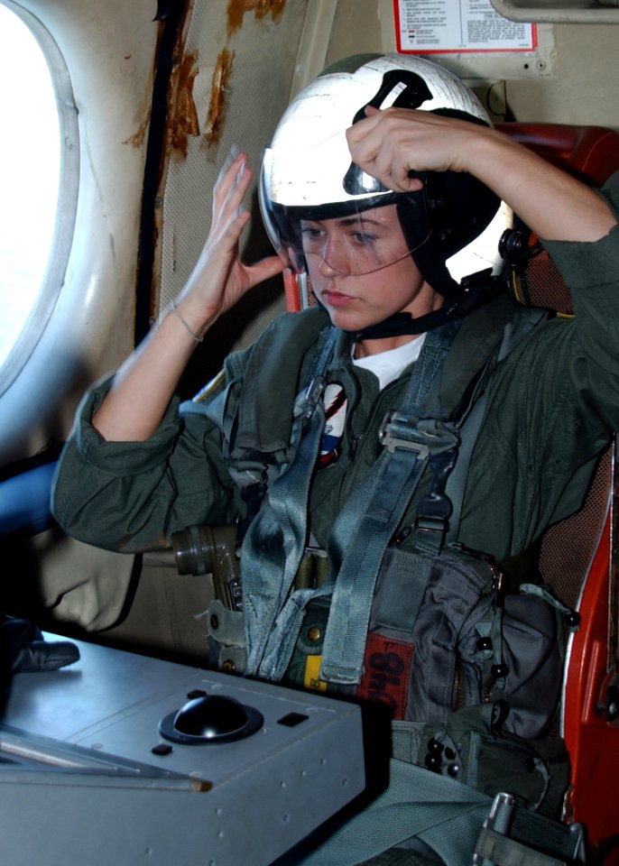 US Navy 070213-N-1810F-087 Cryptologic Technician Seaman Shelbie Cain assigned to Patrol Squadron Three Zero (VP-30) dons her helmet for an immediate ditch drill during a training flight