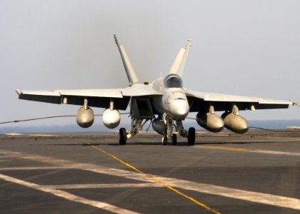 US Navy 070217-N-8446A-004 An F-A-18E Super Hornet assigned to Strike Fighter Squadron One Four Three (VFA-143) makes an arrested landing aboard Nimitz-class aircraft carrier USS Dwight D. Eisenhower (CVN 69)