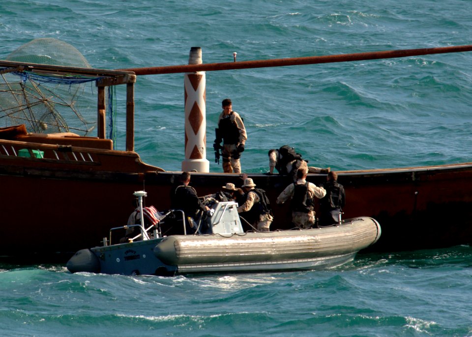 US Navy 070209-N-8623S-014 Sailors stationed aboard guided missile destroyer USS Ramage (DDG 61) board a regional fishing dhow while conducting visit, board, search and seizure (VBSS) operations in the Persian Gulf