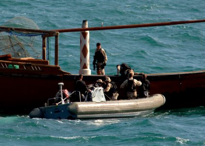 US Navy 070209-N-8623S-014 Sailors stationed aboard guided missile destroyer USS Ramage (DDG 61) board a regional fishing dhow while conducting visit, board, search and seizure (VBSS) operations in the Persian Gulf