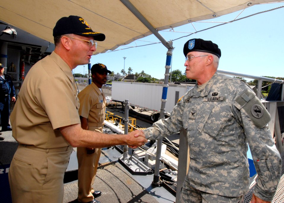 US Navy 070214-N-4965F-001 USS Lake Erie (CG 70) Commanding Officer, Capt. Randall Hendrickson, greets U.S. Army Pacific (USARPAC) Command Chaplain, Col. Chip Fowler on the ship's quarterdeck during a visit