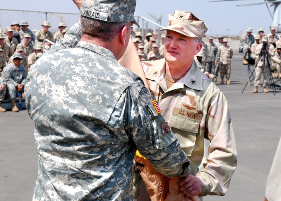 US Navy 070214-N-1328C-074 U.S. Navy Rear Adm. James Hart receives the Combined Joint Task Force-Horn of Africa (CJTF-HOA) command flag from Commander, U.S. Central Command, U.S. Army Gen. John Abizaid, during CJTF-HOA change o