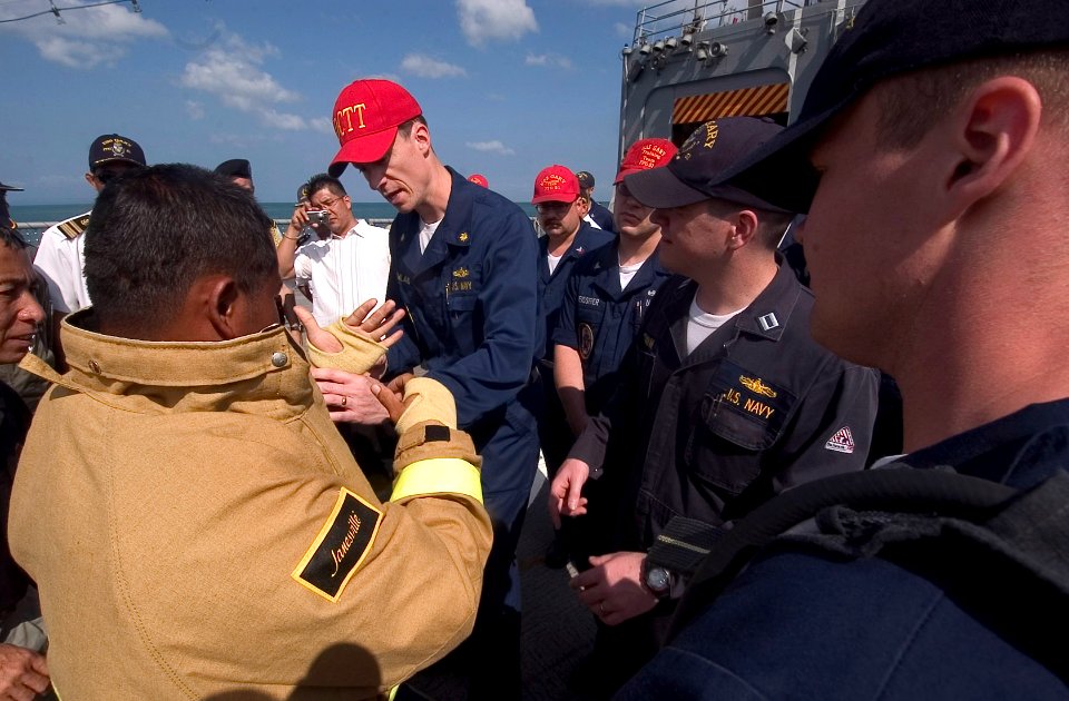 US Navy 070211-N-8534H-010 Sailors stationed aboard the guided-missile frigate USS Gary (FFG 51) demonstrate damage control procedures to Royal Cambodian Navy Sailors on the flight deck of Gary
