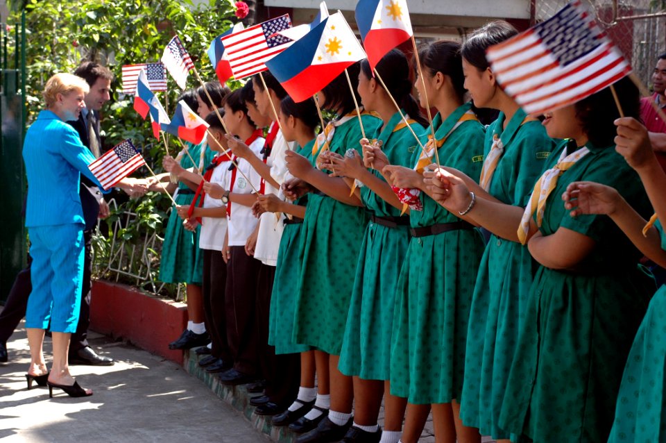 US Navy 070209-N-9604C-171 U.S. Ambassador to the Philippines Kristie Kenney and Deputy Chief of Mission for the U.S. Embassy in Manila Paul Jones are greeted by Manila High School students