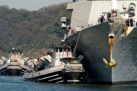 US Navy 070212-N-5253W-002 Tugboats come alongside the Arleigh Burke-class guided-missile destroyer USS Stethem (DDG 63) as it pulls into forward deployed operating base Commander Fleet Activities Yokosuka