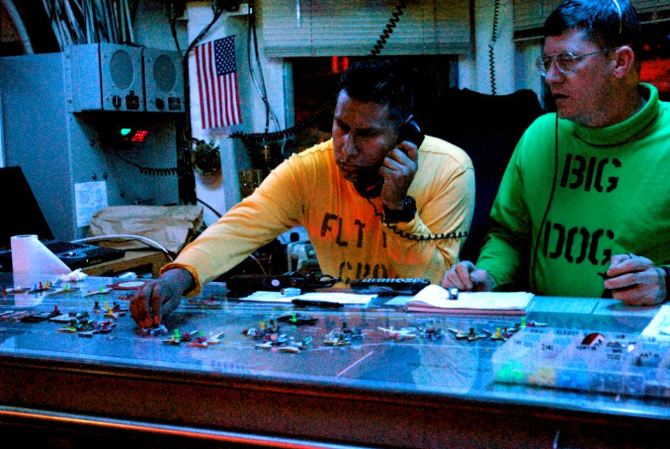 US Navy 070217-N-4133B-011 Senior Chief Aviation Structural Mechanic Gary Beversluis, Big Dog, and Chief Aviation Boatswain's Mate (Handling) Saul Mendo man flight deck control aboard USS Ronald Reagan (CVN 76)