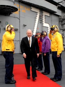 US Navy 070222-N-5345W-107 Secretary of Defense (SECDEF) the Honorable Dr. Robert M. Gates departs USS Harry S. Truman (CVN 75) through rainbow side boys after touring the Nimitz-class aircraft carrier