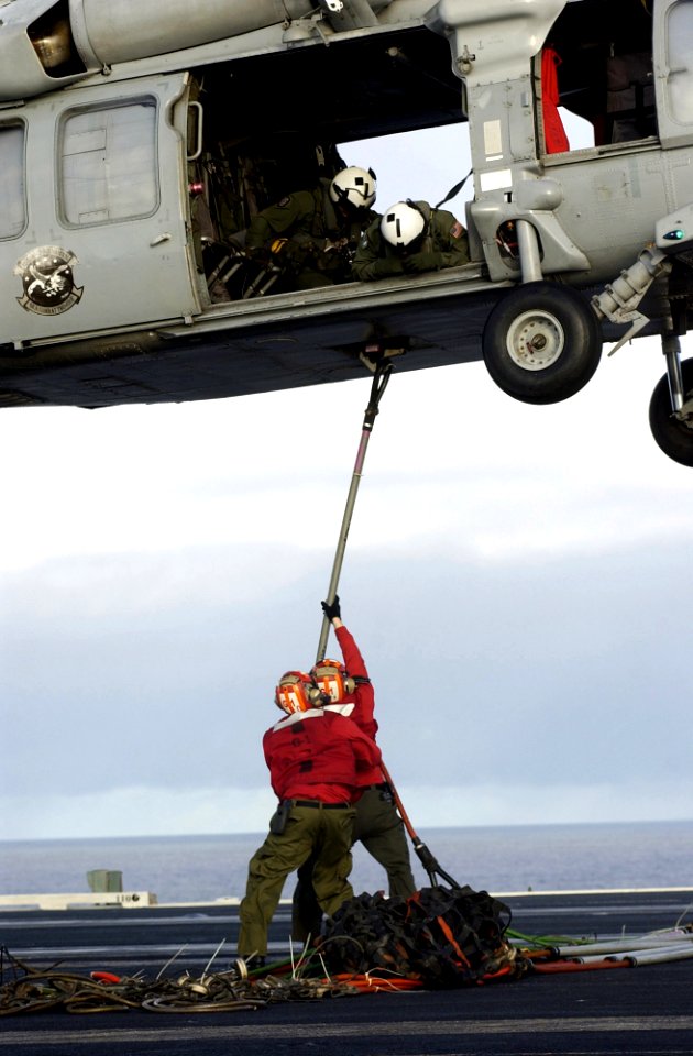 US Navy 070217-N-7130B-256 Upon completion of a vertical replenishment (VERTREP) of ordnance with Military Sealift Command (MSC) ammunition ship USNS Kiska (T-AE 35), aviation ordnancemen on board USS Ronald Reagan (CVN 76) att