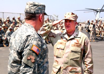 US Navy 070214-N-1328C-080 U.S. Navy Rear Adm. James Hart acknowledges receiving command of Combined Joint Task Force-Horn of Africa (CJTF-HOA) from Commander, U.S. Central Command, U.S Army Gen. John Abizaid photo