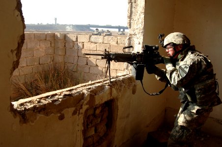 US Navy 070223-N-8148A-024 Spc. Brett Bell, fire support specialist assigned to Echo Company, 2nd Battalion, 5th Cavalry Regiment, 1st Cavalry Division, searches for contacts during a search for the remains of a missing Soldier