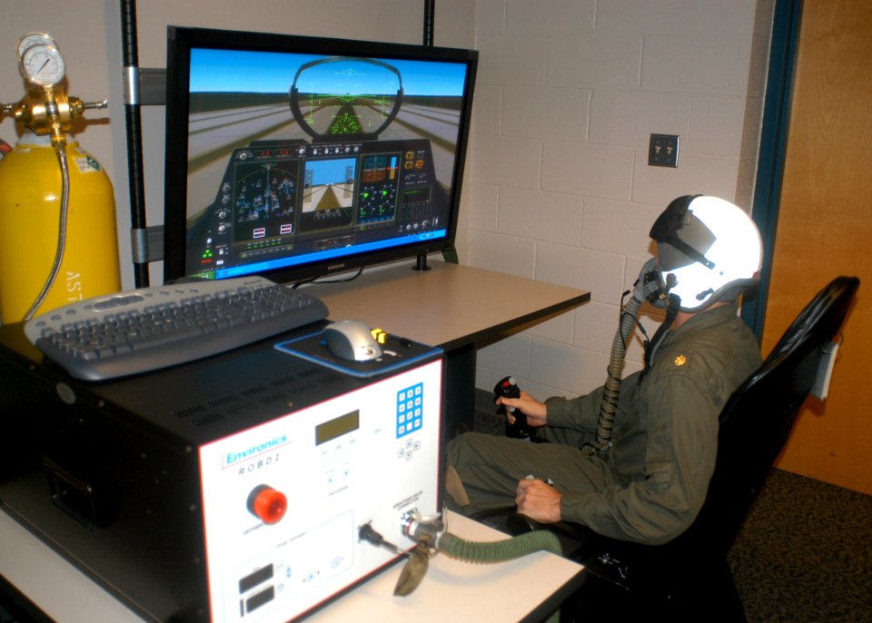 US Navy 070216-N-6247M-009 Lt. Cmdr. James McAllister, from San Diego, Calif. sits in the simulator during a test flight using the new Reduced Oxygen Breathing Device (ROBD)