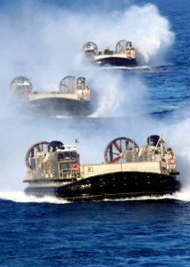 US Navy 070226-N-6710M-002 Three Landing Craft Air Cushions (LCAC) prepare to enter the well deck of dock landing ship USS Tortuga (LSD 46) after conducting LCAC maintenance turns