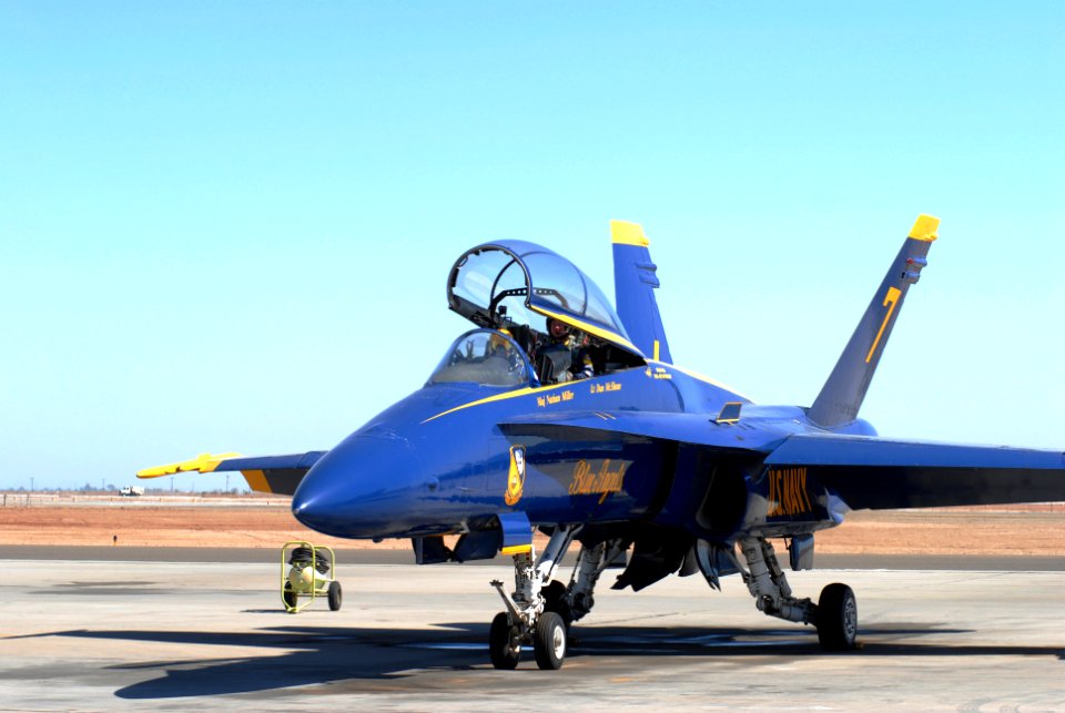 US Navy 070226-N-9195K-060 Shane Huffman, driver of the Navy's ^88 Monte Carlo in the NASCAR Busch Series, and Blue Angels pilot, Marine Corps Maj. Nathan Miller, prepare to taxi to the runway